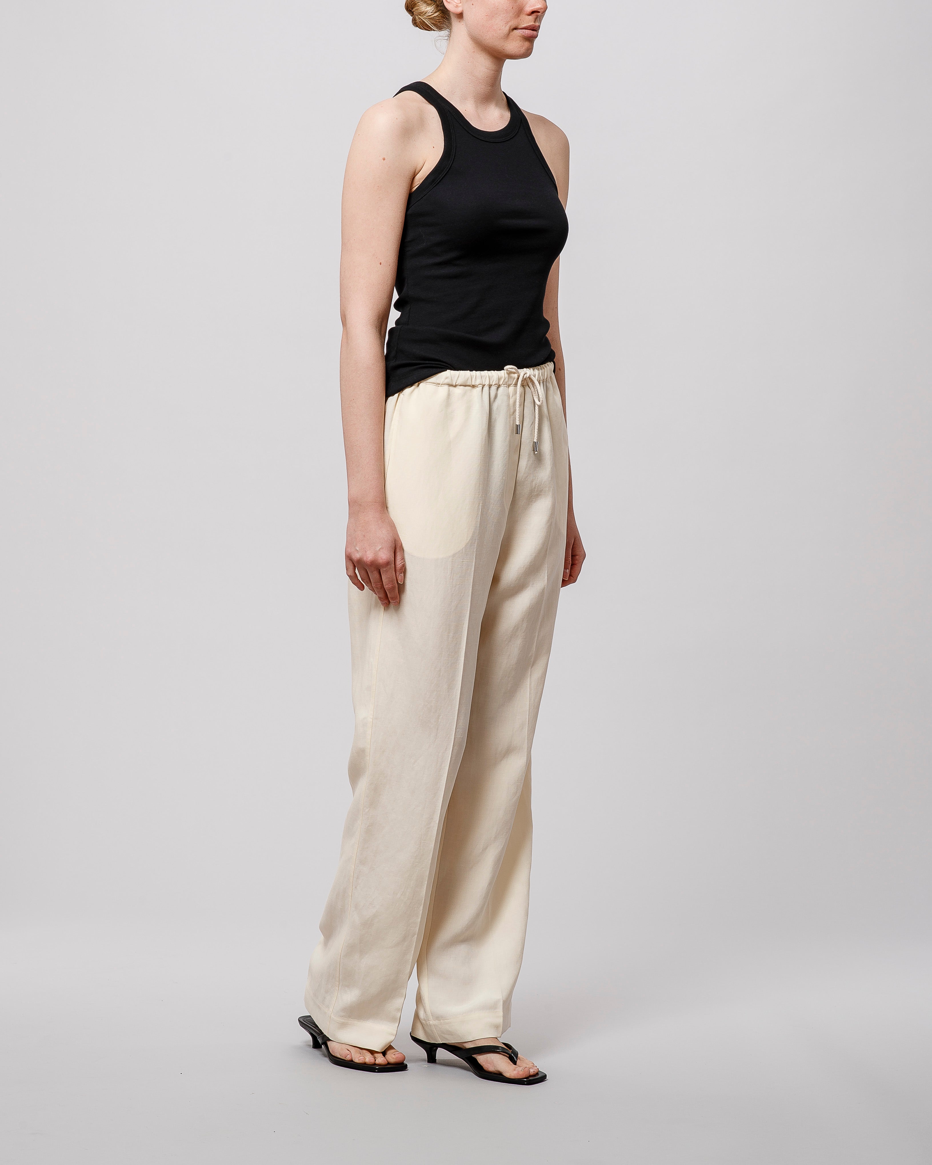 Toteme Press-creased Drawstring Trousers Vanilla